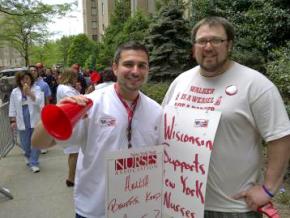 Anthony Ciampa (left), a newly elected director at large of the NYSNA, stands with a supporter at a protest