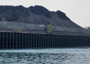Petcoke stored on the banks of the Calumet River south of Chicago