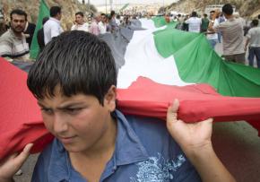 A boy leads a protest in the village of Ni'lin in the West Bank