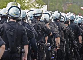 A column of riot police prepares to confront protesters in Chicago